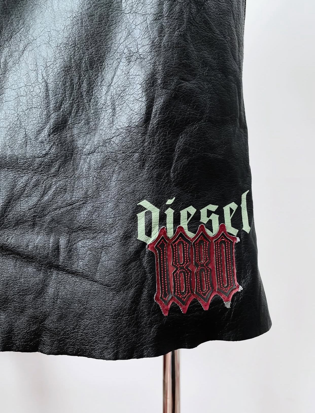 DIESEL LOGO LEATHER DRESS.
