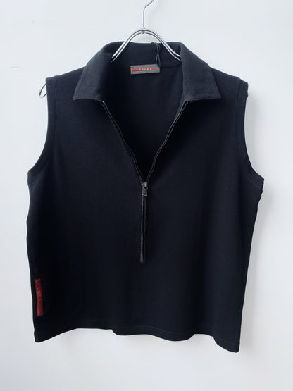 Prada — Sleeveless Polo Zip Top.