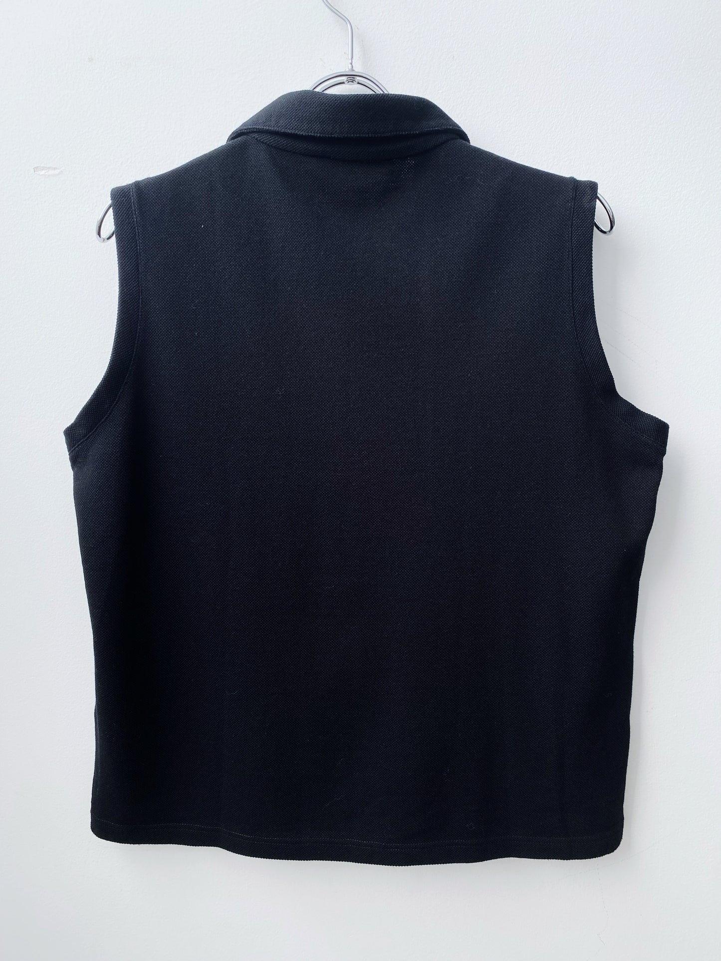 Prada — Sleeveless Polo Zip Top.