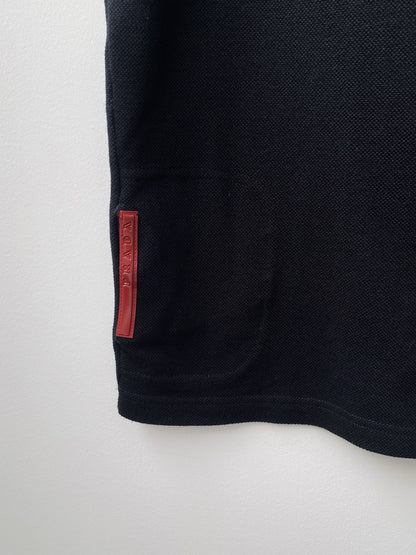 Prada — Sleeveless Polo Zip Top.